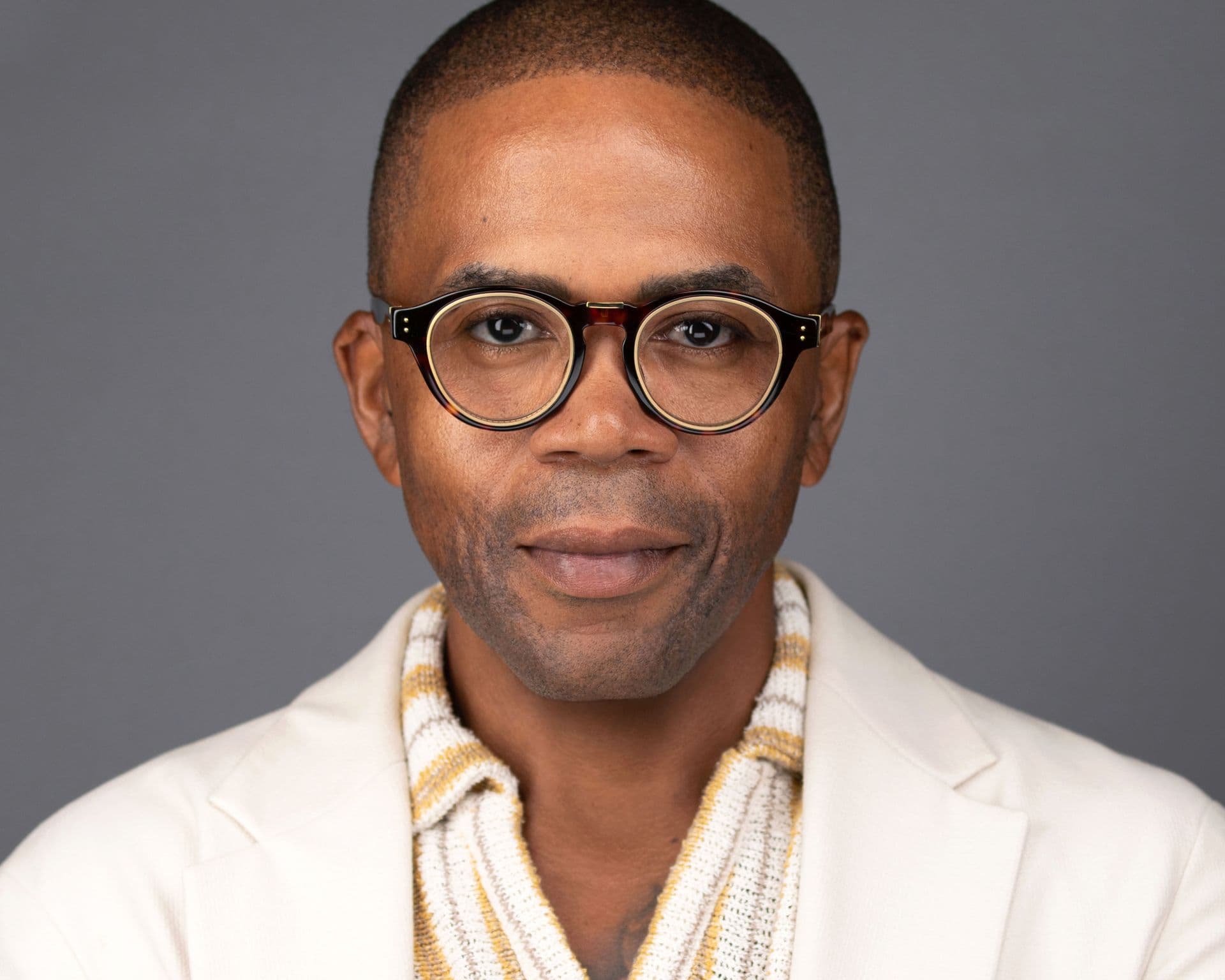 Professional headshot — Dennis